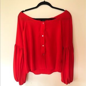 Bright orange/red blouse